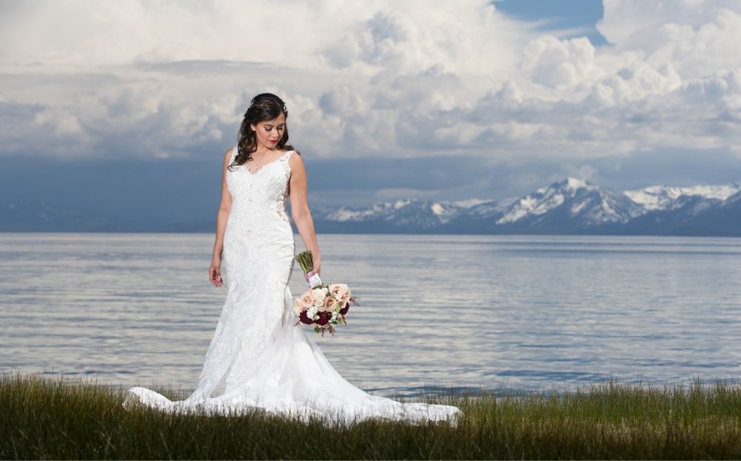 Bride on the shore of Lake Tahoe wedding venue