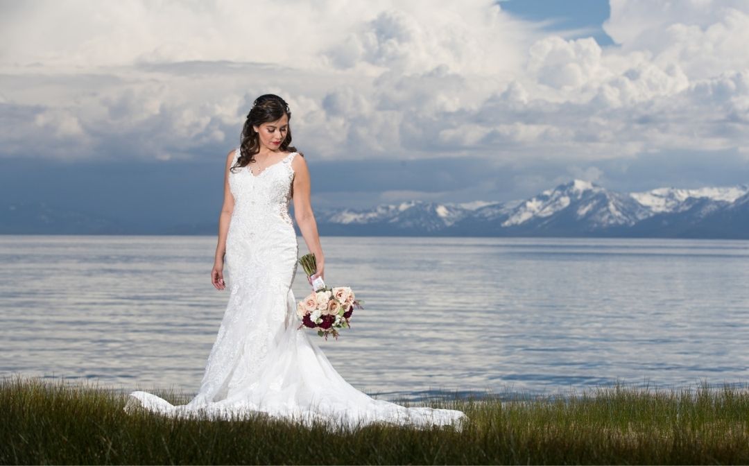Bride on the shore of Lake Tahoe wedding venue, How to Choose a Wedding Venue, What to Consider When Choosing a Wedding Venue