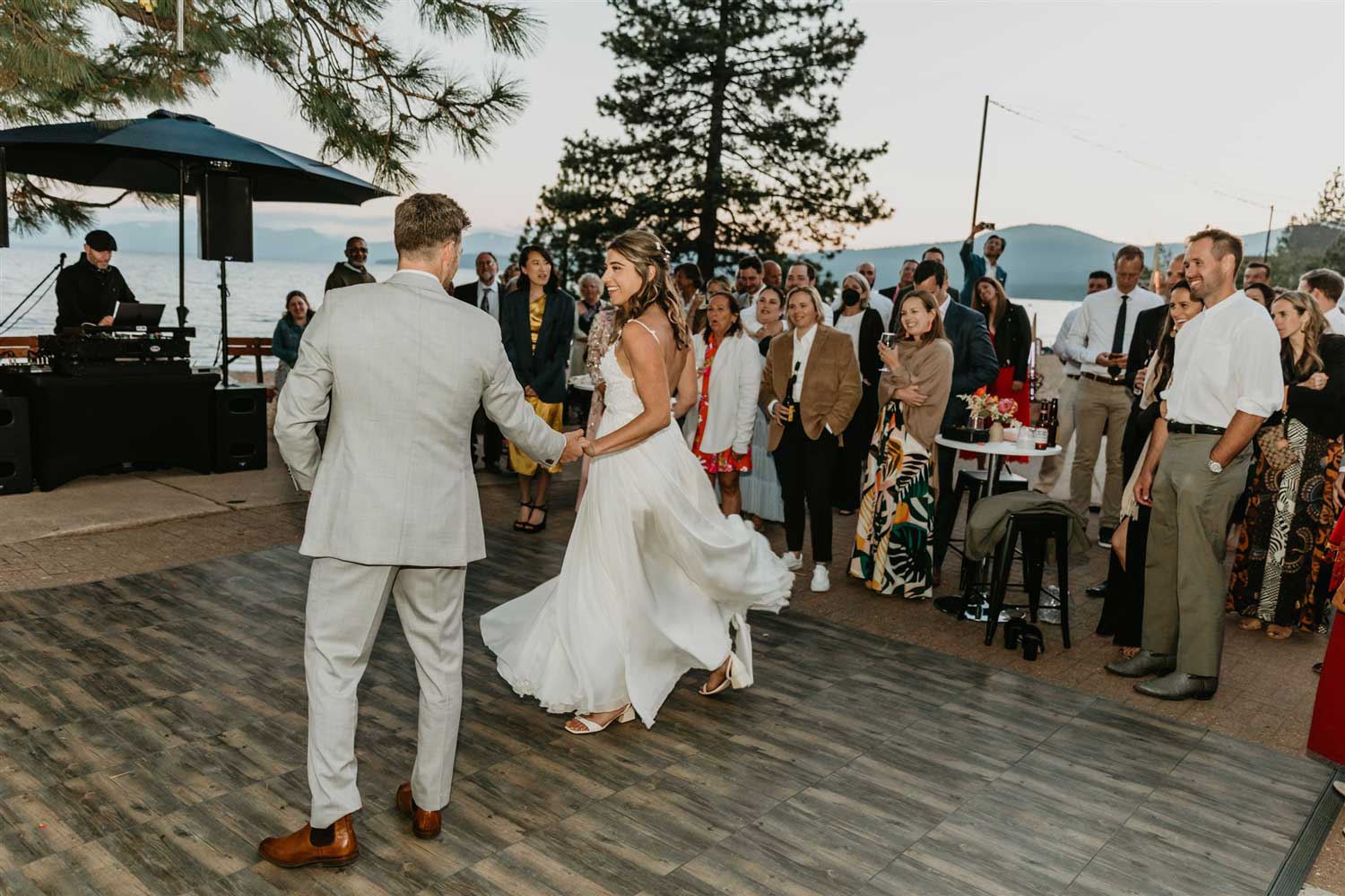 bride and groom dancing at reception on lake tahoe shores