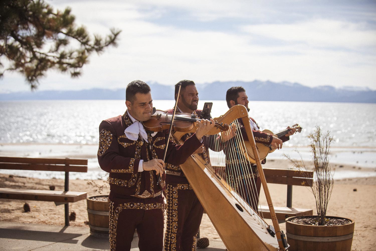 Mariachi band performing outdoors with Lake Tahoe in the background
