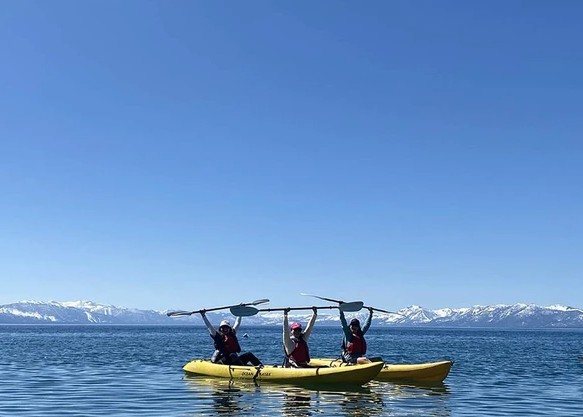 Three people kayaking on lake tahoe