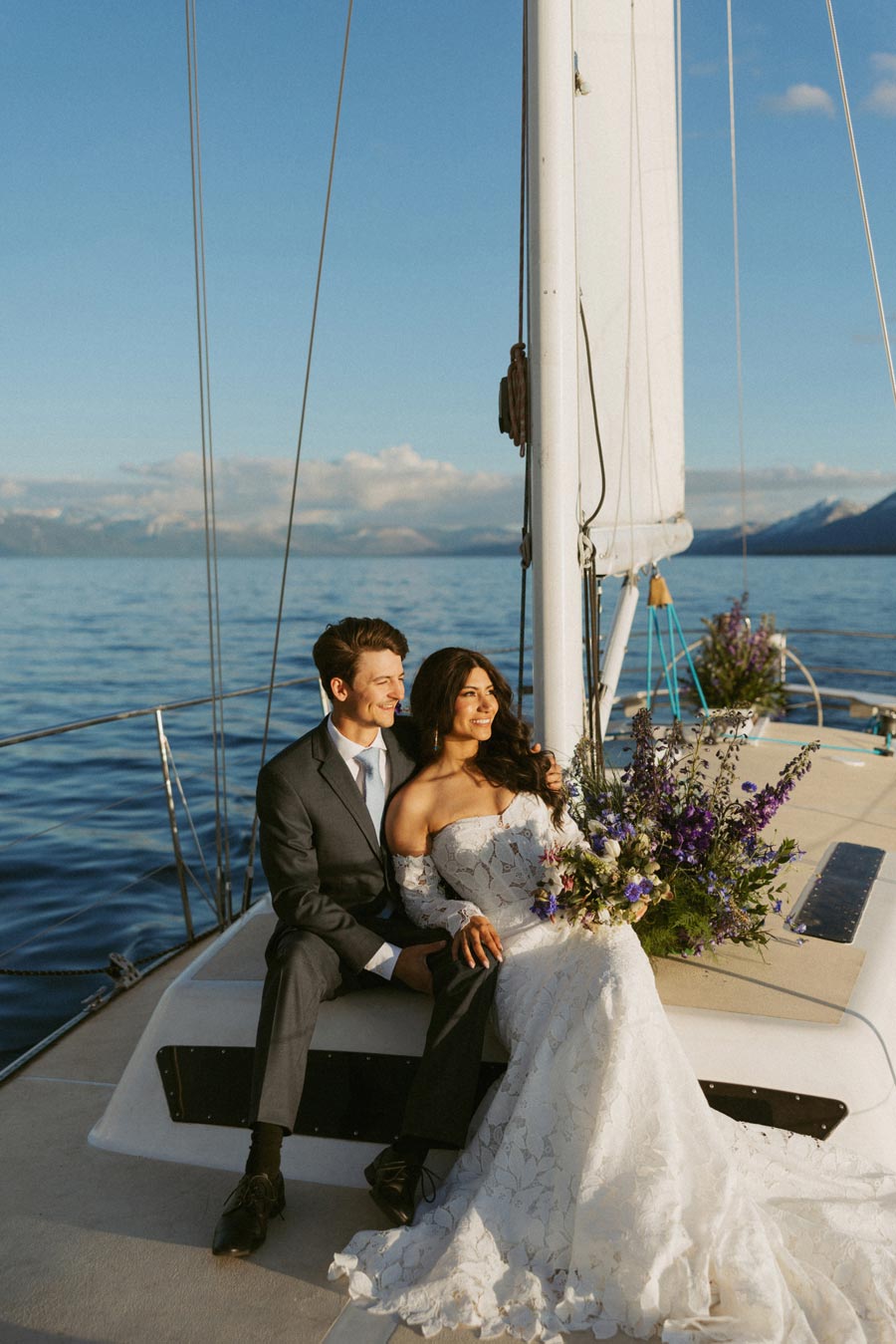Bride and groom on a sailboat on Lake Tahoe